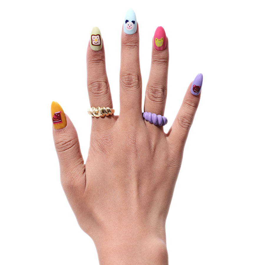 Go! Picnic press-on nails with cute cartoon characters: a monkey, panda, frog, and bear.