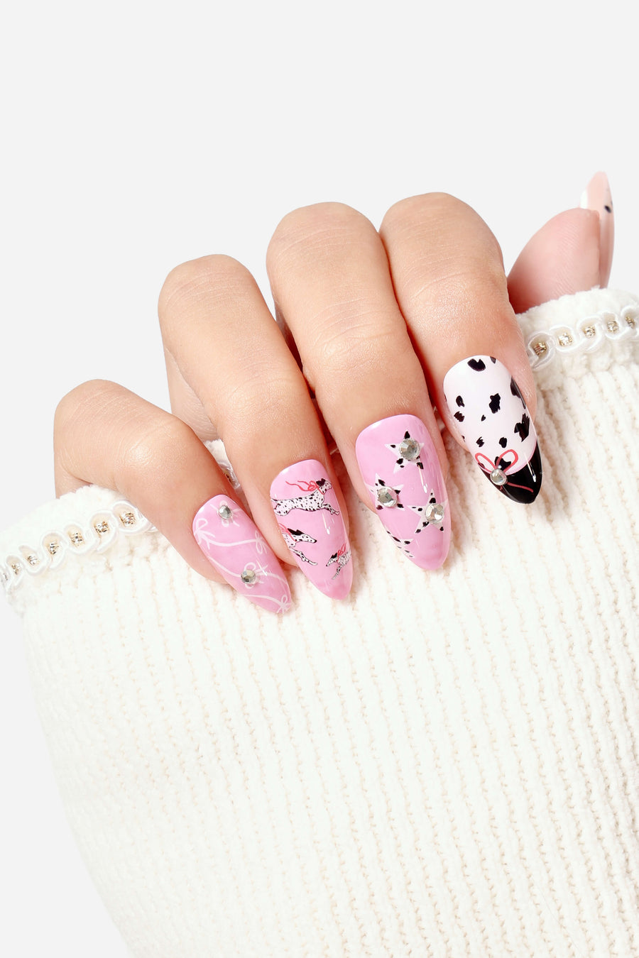 Dashing Dalmatian almond press-on nails with Dalmatian dog and star designs, adorned with rhinestones.